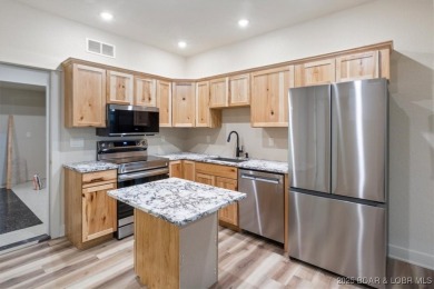 The stunning new construction in the highly sought after *Porto on The Club At Porto Cima in Missouri - for sale on GolfHomes.com, golf home, golf lot