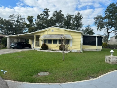 This is a very large 1,326 sq ft Palm Harbor home with a great on The Meadows At Countrywood in Florida - for sale on GolfHomes.com, golf home, golf lot