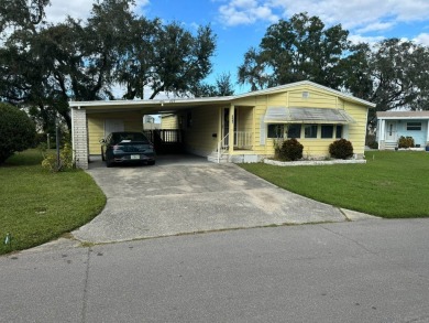 This is a very large 1,326 sq ft Palm Harbor home with a great on The Meadows At Countrywood in Florida - for sale on GolfHomes.com, golf home, golf lot