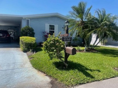 This well maintained 2/2 home is located on the golf course in on Lake Henry Golf Club in Florida - for sale on GolfHomes.com, golf home, golf lot