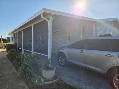 This well maintained 2/2 home is located on the golf course in on Lake Henry Golf Club in Florida - for sale on GolfHomes.com, golf home, golf lot