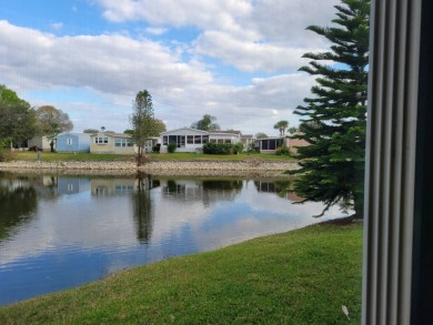 Awe inspiring views of the water and florida wildlife await you on Golden Lakes Golf Course in Florida - for sale on GolfHomes.com, golf home, golf lot