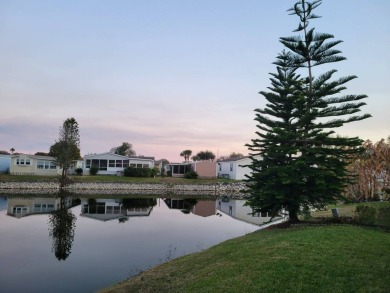 Awe inspiring views of the water and florida wildlife await you on Golden Lakes Golf Course in Florida - for sale on GolfHomes.com, golf home, golf lot