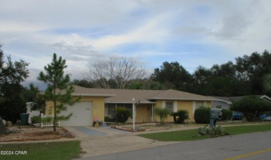 As one of the original sturdy concrete block homes that was on Sunny Hills Golf and Country Club in Florida - for sale on GolfHomes.com, golf home, golf lot