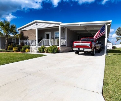 Welcome to this charming 2022 Palm Harbor home nestled in the on Lily Lake Golf and RV Resort in Florida - for sale on GolfHomes.com, golf home, golf lot