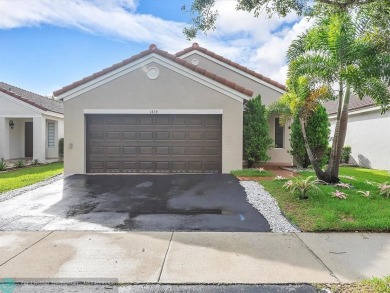 Rare opportunity to own this One-story home with 3 Bedrooms, 2 on Weston Hills Country Club in Florida - for sale on GolfHomes.com, golf home, golf lot