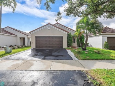 Rare opportunity to own this One-story home with 3 Bedrooms, 2 on Weston Hills Country Club in Florida - for sale on GolfHomes.com, golf home, golf lot