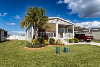 Welcome to this charming 2022 Palm Harbor home nestled in the on Lily Lake Golf and RV Resort in Florida - for sale on GolfHomes.com, golf home, golf lot