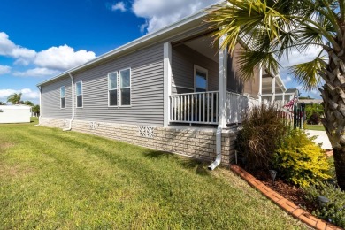 Welcome to this charming 2022 Palm Harbor home nestled in the on Lily Lake Golf and RV Resort in Florida - for sale on GolfHomes.com, golf home, golf lot