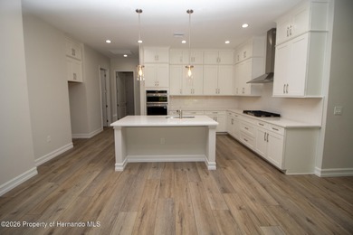 This beautiful semi-custom home by Spire Homes is set on a on Southern Hills Plantation Club in Florida - for sale on GolfHomes.com, golf home, golf lot