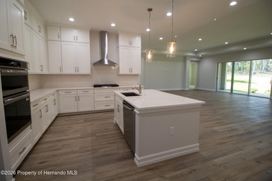 This beautiful semi-custom home by Spire Homes is set on a on Southern Hills Plantation Club in Florida - for sale on GolfHomes.com, golf home, golf lot