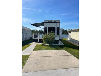 LAKEFRONT LIVING! RETIRE WITH CONFIDENCE!! Welcome to Kove on Cypress Point RV Golf Club in Florida - for sale on GolfHomes.com, golf home, golf lot