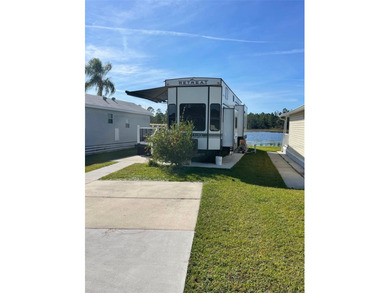 LAKEFRONT LIVING! RETIRE WITH CONFIDENCE!! Welcome to Kove on Cypress Point RV Golf Club in Florida - for sale on GolfHomes.com, golf home, golf lot