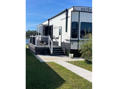 LAKEFRONT LIVING! RETIRE WITH CONFIDENCE!! Welcome to Kove on Cypress Point RV Golf Club in Florida - for sale on GolfHomes.com, golf home, golf lot