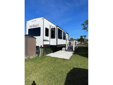 LAKEFRONT LIVING! RETIRE WITH CONFIDENCE!! Welcome to Kove on Cypress Point RV Golf Club in Florida - for sale on GolfHomes.com, golf home, golf lot