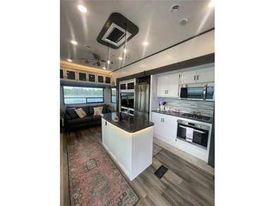 LAKEFRONT LIVING! RETIRE WITH CONFIDENCE!! Welcome to Kove on Cypress Point RV Golf Club in Florida - for sale on GolfHomes.com, golf home, golf lot