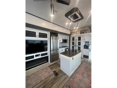 LAKEFRONT LIVING! RETIRE WITH CONFIDENCE!! Welcome to Kove on Cypress Point RV Golf Club in Florida - for sale on GolfHomes.com, golf home, golf lot