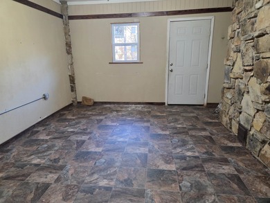 Welcome home to this inviting 3-bedroom, all-electric property on Cherokee Village South Course in Arkansas - for sale on GolfHomes.com, golf home, golf lot