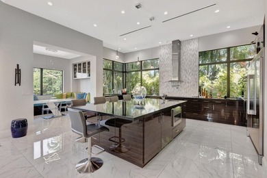 Welcome to waterfront living, in prestigious Frenchman's Creek on Frenchmans Creek Country Club in Florida - for sale on GolfHomes.com, golf home, golf lot