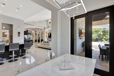 Welcome to waterfront living, in prestigious Frenchman's Creek on Frenchmans Creek Country Club in Florida - for sale on GolfHomes.com, golf home, golf lot