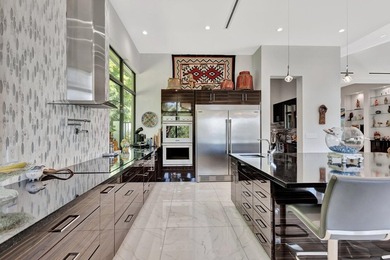 Welcome to waterfront living, in prestigious Frenchman's Creek on Frenchmans Creek Country Club in Florida - for sale on GolfHomes.com, golf home, golf lot