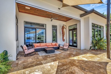 Welcome to waterfront living, in prestigious Frenchman's Creek on Frenchmans Creek Country Club in Florida - for sale on GolfHomes.com, golf home, golf lot