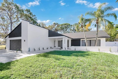 Prepare to be impressed by this fully remodeled Clearwater gem on Countryside Country Club in Florida - for sale on GolfHomes.com, golf home, golf lot