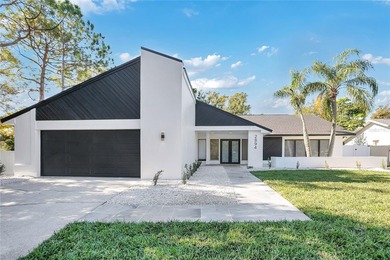 Prepare to be impressed by this fully remodeled Clearwater gem on Countryside Country Club in Florida - for sale on GolfHomes.com, golf home, golf lot