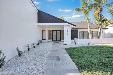 Prepare to be impressed by this fully remodeled Clearwater gem on Countryside Country Club in Florida - for sale on GolfHomes.com, golf home, golf lot