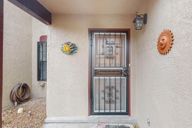 Desirable neighborhood with passive solar townhomes.  This home on Arroyo Del Oso Golf Course in New Mexico - for sale on GolfHomes.com, golf home, golf lot