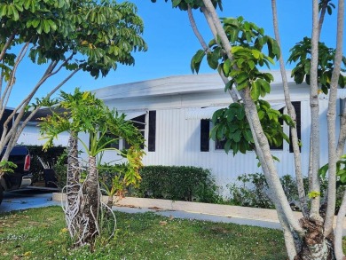 Three bedroom, Two bath with lots of space inside and out, Just on Cypress Creek Country Club - Boynton Beach in Florida - for sale on GolfHomes.com, golf home, golf lot