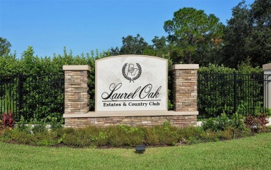 Welcome to this exceptional five-bedroom, five-and-a-half-bath on Laurel Oak Country Club in Florida - for sale on GolfHomes.com, golf home, golf lot