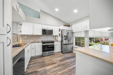What a *WOW* when you walk into this beautifully updated villa on University Park Country Club in Florida - for sale on GolfHomes.com, golf home, golf lot