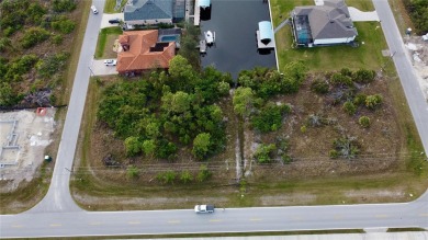 This exceptional WATERFRONT lot in South Gulf Cove offers direct on Rotonda Golf and Country Club - Long Marsh  in Florida - for sale on GolfHomes.com, golf home, golf lot