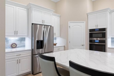 One or more photo(s) has been virtually staged. One or more on The Grand Club Cypress Course in Florida - for sale on GolfHomes.com, golf home, golf lot