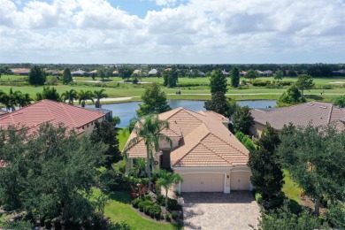 Positioned on a premier south-facing homesite with serene lake on Ritz-Carlton Members Golf Club in Florida - for sale on GolfHomes.com, golf home, golf lot