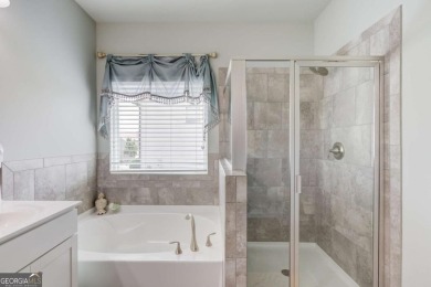Located in the highly sought-after Traditions of Braselton, this on Traditions of Braselton Golf Club in Georgia - for sale on GolfHomes.com, golf home, golf lot