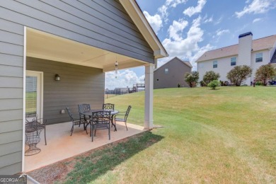 Located in the highly sought-after Traditions of Braselton, this on Traditions of Braselton Golf Club in Georgia - for sale on GolfHomes.com, golf home, golf lot