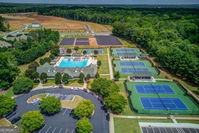 Located in the highly sought-after Traditions of Braselton, this on Traditions of Braselton Golf Club in Georgia - for sale on GolfHomes.com, golf home, golf lot