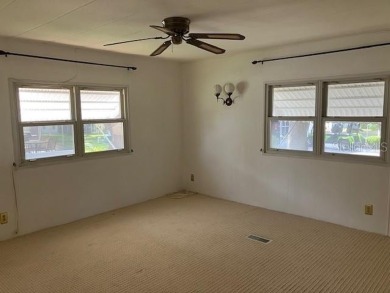 Welcome to this 2-bedroom, 2-bath manufactured home nestled in on Orange Blossom Hills Golf and Country Club in Florida - for sale on GolfHomes.com, golf home, golf lot