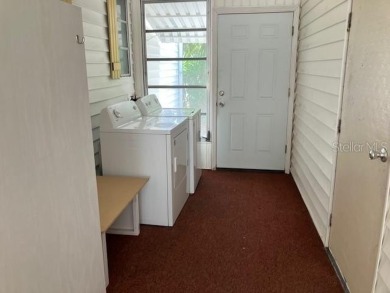 Welcome to this 2-bedroom, 2-bath manufactured home nestled in on Orange Blossom Hills Golf and Country Club in Florida - for sale on GolfHomes.com, golf home, golf lot