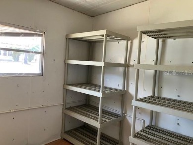 Welcome to this 2-bedroom, 2-bath manufactured home nestled in on Orange Blossom Hills Golf and Country Club in Florida - for sale on GolfHomes.com, golf home, golf lot