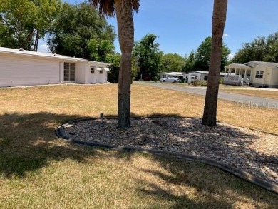 Welcome to this 2-bedroom, 2-bath manufactured home nestled in on Orange Blossom Hills Golf and Country Club in Florida - for sale on GolfHomes.com, golf home, golf lot