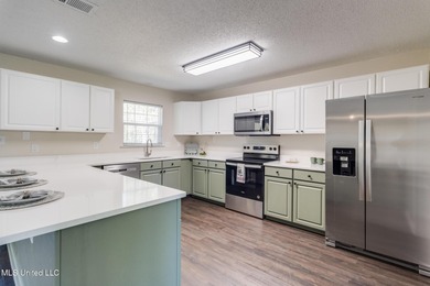 Welcome to this fully renovated, move-in ready ranch home in on Diamondhead Country Club in Mississippi - for sale on GolfHomes.com, golf home, golf lot