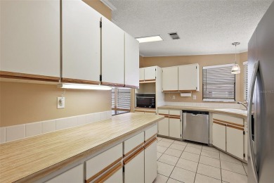 This 2 bedroom 2 bath home is situated on an oversized lot just on Bay Tree Golf Course in Florida - for sale on GolfHomes.com, golf home, golf lot
