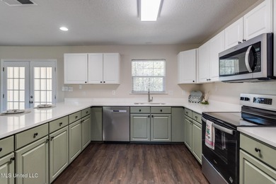 Welcome to this fully renovated, move-in ready ranch home in on Diamondhead Country Club in Mississippi - for sale on GolfHomes.com, golf home, golf lot