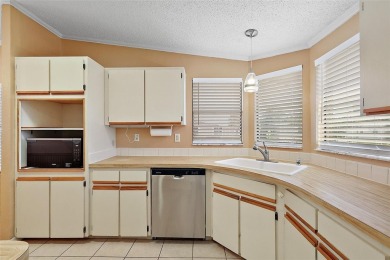 This 2 bedroom 2 bath home is situated on an oversized lot just on Bay Tree Golf Course in Florida - for sale on GolfHomes.com, golf home, golf lot
