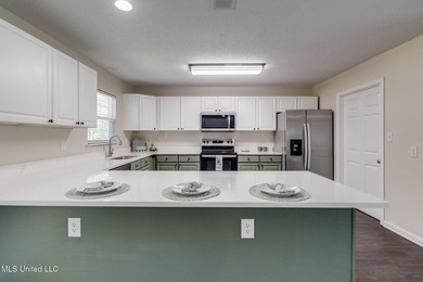 Welcome to this fully renovated, move-in ready ranch home in on Diamondhead Country Club in Mississippi - for sale on GolfHomes.com, golf home, golf lot