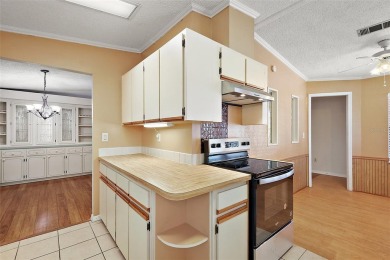 This 2 bedroom 2 bath home is situated on an oversized lot just on Bay Tree Golf Course in Florida - for sale on GolfHomes.com, golf home, golf lot