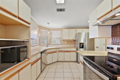 This 2 bedroom 2 bath home is situated on an oversized lot just on Bay Tree Golf Course in Florida - for sale on GolfHomes.com, golf home, golf lot